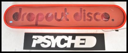 A contemporary retro large light box sign reading Drop Out Disco. The sign of oval form having large