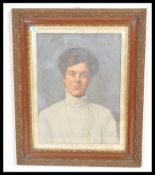 A good quality early 20th Century mahogany picture frame having gilt scrolled decoration with