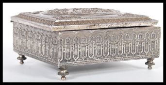 A 19th Century Victorian silver plated jewellery box raised on bun feet with swag adorned window