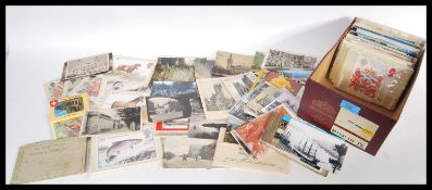 A collection of vintage postcards dating from the early 20th century onwards to include many mid