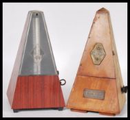 A vintage 20th Century Triangular cased wooden metronome with applied brass mounts Metronome by