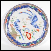 A 20th Century Chinese Republic period porcelain charger plate having hand painted decoration