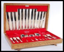 A vintage retro 20th Century 12 person canteen of cutlery containing silver plated and stainless