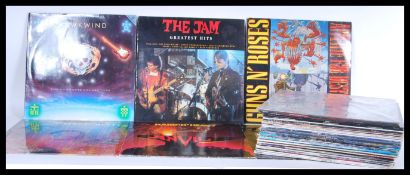 A collection of mostly 1980's rock long play LP vinyl records including Guns and Roses banned