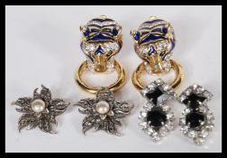 A group of vintage 20th Century designer / costume jewellery dress clips to include a pair of