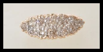 An 18ct gold cluster ring having 12 diamonds illusion set to the head. Estimated 72 pts of diamonds.