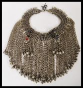 An early 20th Century silver white metal ladies headdress having glass bead stone decoration with