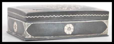 A 19th Century pewter of steel snuff box of rectangular form having silver inlay decoration