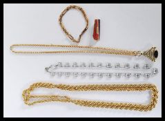 A collection of yellow metal items to include a long plated rope twist chain, length 106cms long,