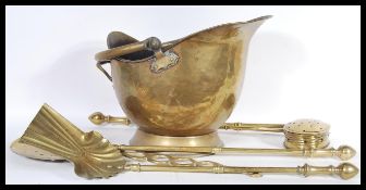 A 19th Century Victorian coal scuttle of helmut form raised on a round base along with a selection