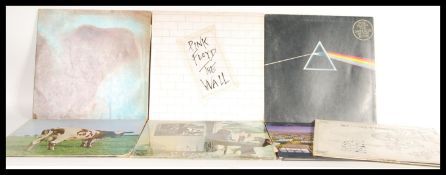 A collection of Long PLay LP vinyl records, all performed by Pink Floyd to include Atom Heart
