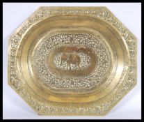 An early 20th century circa 1900 Indian brass tray depicting an elephant to the central panel. The