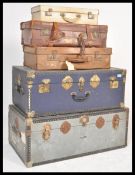 A collection of vintage and retro 20th Century trunks and suitcases, to include two steamer