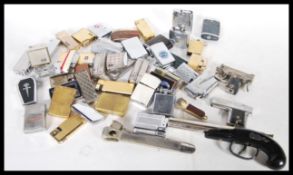 A large collection of vintage lighters to include 5x Zippo lighters, novelty gun lighters, Sarome