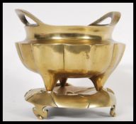 A 19th Century Chinese bronze censer ding incense bowl having shaped body with open loop handles