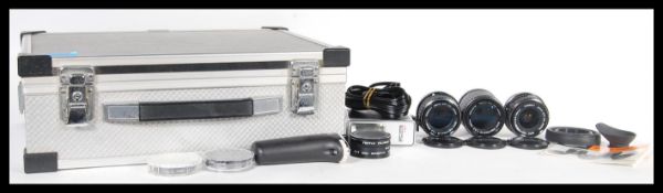 A collection of Pentax camera lenses to include an SMC pentax-M 1:3.5 135mm, SMC Pentax-M 1:1.4