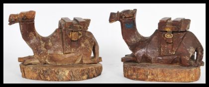 A pair of early 20th Century Edwardian WWI era Jerusalem hand carved olive wood inkwells in the form