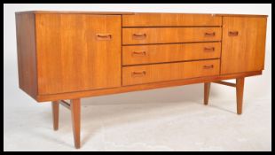 A vintage retro 20th Century teak wood sideboard chest of drawers having a central bank of four