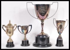 A collection of silver plated Greyhound racing related trophies to include a large trophy for the