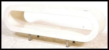 A vintage 20th Century retro oval white laminate coffee / occasional table of hoop shaped raised