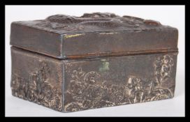 A 19th Century Chinese white metal snuff box / pill pot having relief decoration depicting a