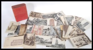 A collection of vintage early to mid 20th Century postcards, mostly black and white architectural