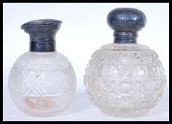 Two 19th Century Victorian hallmarked silver lidded and cut glass perfume bottles of globular