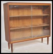 A retro mid 20th century teak wood scratch built glazed fronted bookcase, two full front glazed