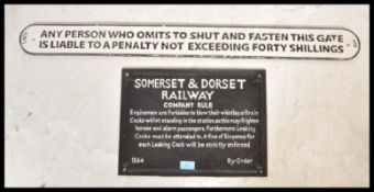 Two cast iron metal railway advertising / warning signs, the signs worded in relief reading Somerset