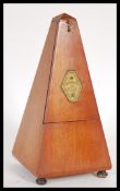 A 20th Century vintage French metronome marked 'Metronome De Maelzel', of typical wooden form,