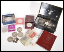 A collection of coins dating from the 19th Century to include coins and notes from all around the