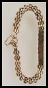 A hallmarked 9ct gold identity bracelet having an unengraved identity bar with box link chain and