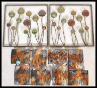 Two pairs of 20th Century wall hanging decorative enamel panels, the first pair constructed within