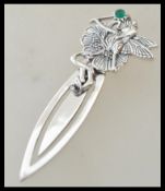 A stamped 925 silver book mark in the form having a finial top in the form of fairy, set with a