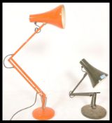 A pair of vintage retro 20th Century anglepoise industrial desk lamps raised on circular bases