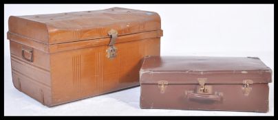 A 20th Century vintage industrial japanned steel trunk having a painted brown finish, along with a