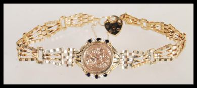 A 9ct gold bracelet chain with hallmarked 9ct heart padlock and 1915 good luck coin inset. Weight