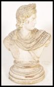 A 20th Century concrete stone composite bust of Apollo Belvedere in typical attire modelled with