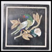 A 19th century Italian Pietra Dura panel of a parrot having a white stone inlay border. Measures