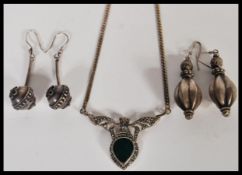 A group of silver jewellery to include a silver box link necklace with marcasite and green stone