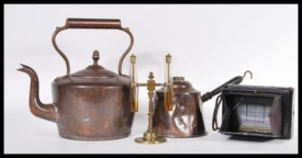 A late 19th / early 20th Century copper spirit kettle having a shaped handle along with a copper