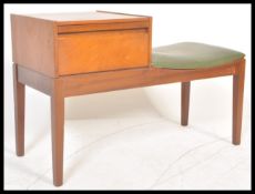 A retro 1970's teak wood telephone table / seat by Mr Chippy, button back seat pad with drawer above