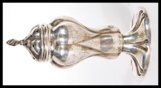 An early 20th Century Edwardian silver hallmarked pepper pot of waisted form, Birmingham assay marks