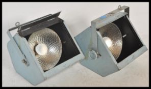 A pair of vintage retro 20th Century theatre stage spotlight spot lamps having brushed steel metal