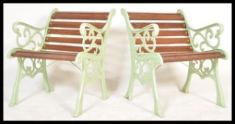 A very heavy pair 20th century cast metal garden seats, recently having new wooden slats added and a