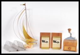 A group of vintage items to include a pair of bookends, brass and teak wood with depictions of the