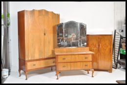 An early 20th Century 1930's  Art Deco walnut bedroom suite consisting of a double wardrobe having a