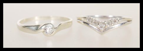 Two 9ct white gold rings to include a wishbone ring set with white accent stones (hallmarked London,
