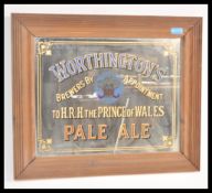 A vintage 20th Century retro pub advertising mirror for Worthington's Pale Ale set within a wooden