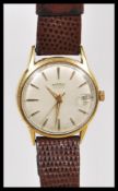 A vintage retro 20th Century 1960's Roamer wrist watch having a champagne dial with gilt baton
